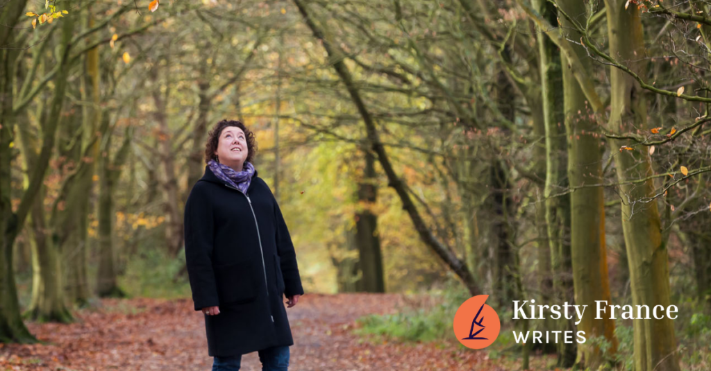 Image shows a woman walking in the woods thinking about why you need a human copywriter as well as AI