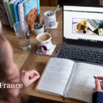 Image shows a woman with dark curly hair sitting at a laptop with a notebook, thinking about how to write for humans